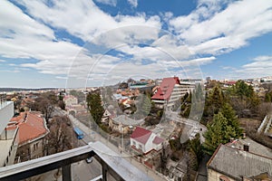 Photo of the city with houses and road. white clouds in the sky