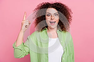 Photo of clever genius woman with perming coiffure dressed shirt in glasses raising finger up get idea isolated on pink