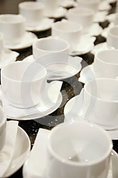 Photo closely standing diagonal rows together 16 white porcelain mugs