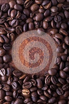 Photo closeup of coffee beans. Rusty background.