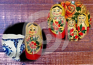 Photo collage Matryoshka-Russian folding doll made of wood, inside which there are dolls of smaller size. Semenovskaya matryoshka