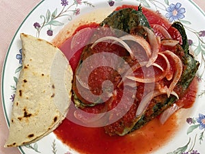 Chilis Rellenos With Tomato Sauce and Tortilla photo