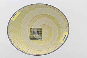 Photo of a Computer Chip CPU put on silicon wafer with microchip