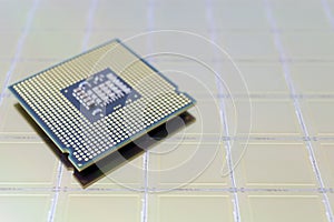 Photo of a Computer Chip CPU put on silicon wafer with microchip