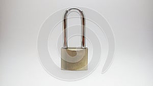 Photo concept of padlock in mini studio  in light grey background.