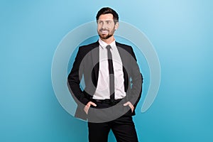 Photo of confident dreamy man specialist wear black tuxedo looking empty space isolated blue color background