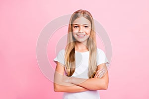 Photo of confident little girl showing brilliant intelligence for her age while isolated with pink background