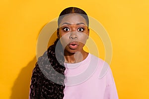 Photo of confused young girl stare speechless stupor cant believe isolated on yellow color background