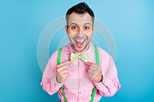 Photo of cool brunet hairdo man touch tie wear pink shirt isolated on blue color background