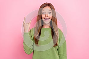 Photo of cool funky school girl dressed green sweatshirt showing hard rock sign  pink color background