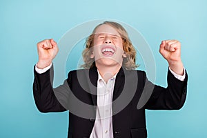 Photo of cool little blond boy yell hands fists wear uniform  on blue color background