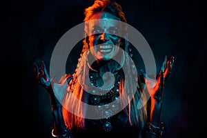 Photo of cool mad mysterious lady wear viking clothes praying demons  dark orange color background