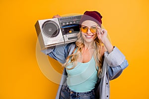 Photo of cool stylish lady long hairdo good mood free time hold shoulder vintage tape recorder wear casual turquoise