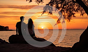 Photo of a couple enjoying a romantic sunset on a rocky beach