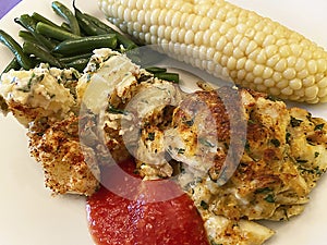 Crab Cake With Cocktail Sauce, Potato Salad, Green Beans and Corn