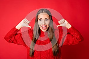 Photo of crazy girl point thumb finger at herself wear jumper isolated over bright shine red color background