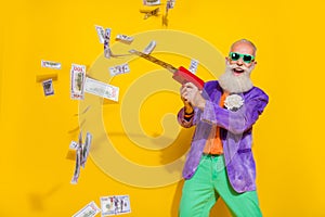 Photo of crazy retired pensioner grandfather win million usd dollars shoot money gun isolated on bright color background