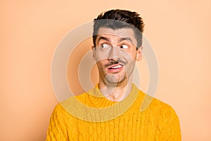 Photo of crazy unhappy shocked man look empty space dislike news face isolated on pastel beige color background