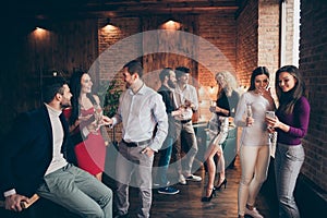 Photo of crowd of working people engaged in business having corporate party with fun and alcohol wearing formally