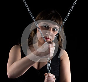 Photo of curvy woman squeezed chains