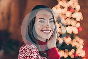 Photo of cute dreamy young lady wear red pullover smiling celebrating christmas indoors house home room