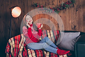 Photo of cute dreamy young woman dressed red sweater communicating modern device drinking new year eggnog indoors room