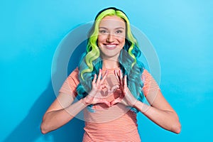 Photo of cute lovely lady with unusual teal hair color show heart symbol say i love you isolated on blue color