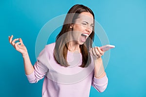 Photo of cute outraged crazy young model girl hold telephone provoked irritated open mouth yell arguing scandal break up