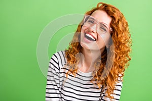 Photo of cute shiny young lady dressed striped clothes glasses smiling laughing isolated green color background