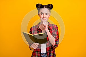 Photo of cute student lady two buns read story favorite novel look up empty space dreamer think over essay writing wear