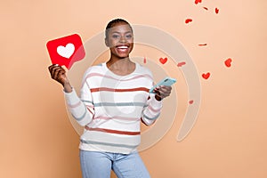 Photo of cute young braids hairdo lady hold telephone heart wear white pullover isolated on beige color background