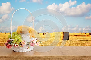 Photo of dairy products over wooden table. Symbols of jewish holiday - Shavuot photo