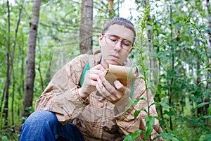 Photo of dark-haired biologist in glasses