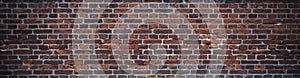 Dark texture of old red bricks wall background