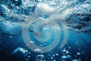 Photo of deep blue ocean water, light bubbles at the surface, underwater view, low angle shot, wideangle lens, hyperrealistic