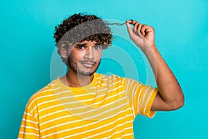 Photo of displeased young man arm touch hold unhealthy hair curl split ends isolated on teal color background