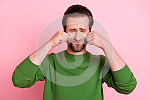 Photo of dissatisfied moody person closed eyes arms wipe tears wear sweater isolated on pink color background