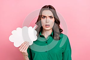 Photo of dissatisfied sad serious woman wavy hairdo dressed green shirt hold dialog cloud looks suspicious isolated on