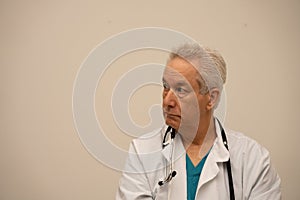 Photo of a doctor looking sideways away from camera