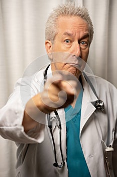 Photo of a doctor pointing his finger at you