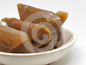 Photo of Dodol or jenang or nian gao is traditional snack from Java, Indonesia isolated on white background.