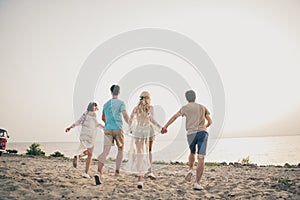 Photo of dream youth fellows enjoy weekend seacoast horizon sunset wear boho outfit nature seaside beach outside