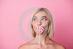 Photo of dreamy adorable lady naked shoulders caramel close mouth looking empty space isolated pink color background