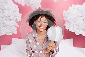 Photo of dreamy adorable lady wear pajama holding stick fluffy clouds isolated pink color background