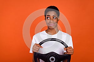 Photo of dreamy butch short hair androgyne woman hold taxi steering wheel empty space isolated bright color background