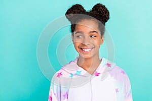 Photo of dreamy cheerful small trendy stylish young african american girl look empty space isolated on teal color