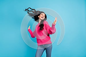 Photo of dreamy crazy happy woman fly hair raise hands enjoy weekend isolated on pastel blue color background