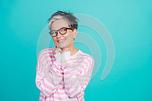 Photo of dreamy thoughtful woman dressed pink pullover eyewear looking empty space isolated teal color background