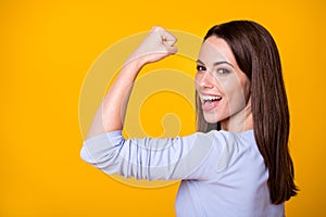 Photo of ecstatic excited girl celebrate gym training lottery win show muscles wear trendy purple clothes isolated over