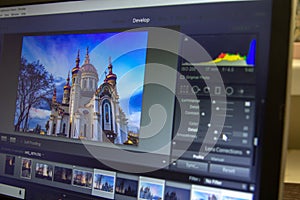 Photo editing on laptop. Photographer`s computer with professional software. Image post processing